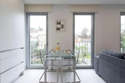a living room with a couch and a table at LovelyStay - Modern Loft with Gym & Free Parking minutes away from CBD in Porto