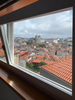 a view of a city from a window at BF Suites & Apartments in Porto