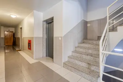 a hallway with stairs in a house at Candal Douro in Vila Nova de Gaia