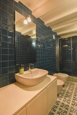 a bathroom with a sink and a toilet at Duque - Guest House in Porto