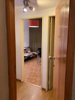 a hallway with a door open to a room at Peter Flat - Rio Douro & Caves Vinho do Porto in Vila Nova de Gaia