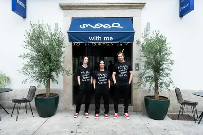 a group of people standing in front of a store at chic&basic Gravity in Porto