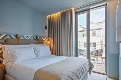 a bathroom with a sink and a shower at Pur Oporto Boutique Hotel by actahotels in Porto