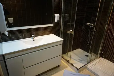 a bathroom with a sink and a shower at CoolHostel in Porto