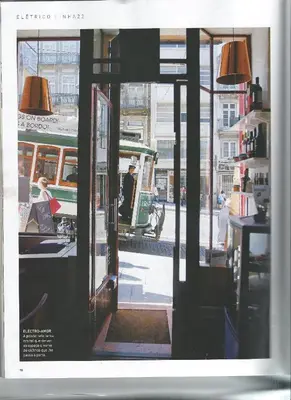 an open door to a building with a tram at Linha 22 in Porto
