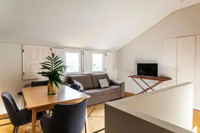 a living room with a couch and a table at Citybreak-apartments Lapa in Porto