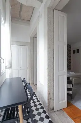 a room with a table and a checkered floor at Citybreak-apartments Lapa in Porto