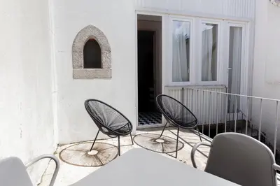 two chairs and a table on a balcony at Citybreak-apartments Lapa in Porto