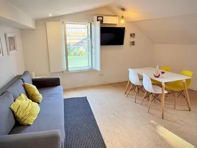 a living room with a couch and a table at Ribeira Cinema Apartments in Porto