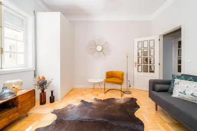 a living room with a couch and a table at Nomad's By Sta Catarina Flats - 3BED Porto in Porto
