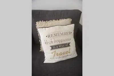 a pillow with the words remember notproductive is a new job harder than a destination at Softly Porto in Porto