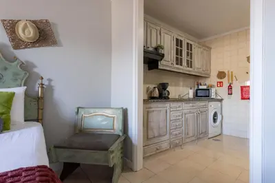 a kitchen with a sink and a microwave in a room at MyRiverPlace N 4 Private Terrace River View Porto apartments in Vila Nova de Gaia