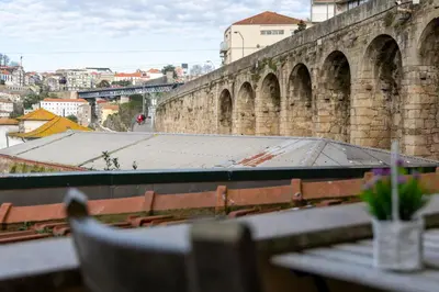 a view of a large brick building with a table at MyRiverPlace N 4 Private Terrace River View Porto apartments in Vila Nova de Gaia