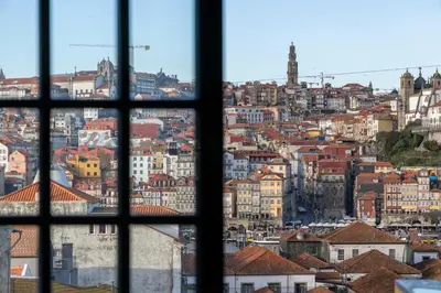 a view of a city from a window at MyRiverPlace N 4 Private Terrace River View Porto apartments in Vila Nova de Gaia