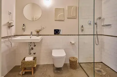 a bathroom with a toilet and a sink and a shower at Oporto Maison Anselmo in Porto