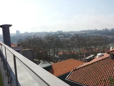 a view of the city from the roof of a building at Studio with terrace @ historic center in Porto