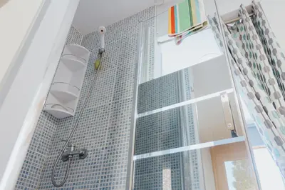 a bathroom with a shower with a building at House Romantic R/C Right in Porto
