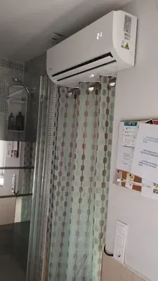 a bathroom with a shower with a shower curtain at House Romantic R/C Right in Porto