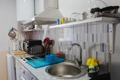 a kitchen counter with a sink and a sink at House Romantic R/C Right in Porto