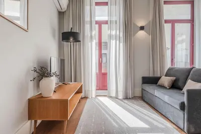 a kitchen with a sink and a table at Uma Formosa Apartments in Porto