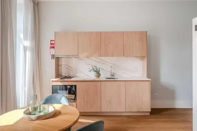 a living room with a couch and a table at Uma Formosa Apartments in Porto