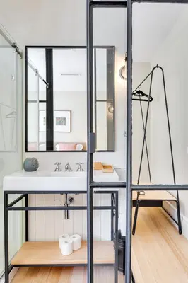 a bathroom with a sink and a mirror at Jardins da Muralha Apartments by DA'HOME in Porto