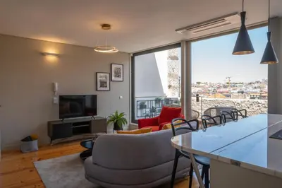 a living room with a couch and a table at Rooftop Balcony at Porto Historic Center in Porto