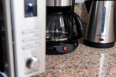 a coffee pot sitting on a counter next to a blender at Virtudes Terrace in Porto