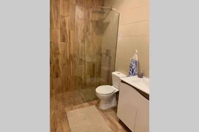 a bathroom with a toilet and a shower at City Heart Place 3 in Porto