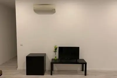 a living room with a tv and a table at City Heart Place 3 in Porto