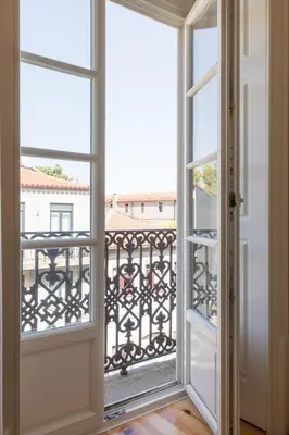 an open door with a view of a balcony at Wine Luxury House in Porto