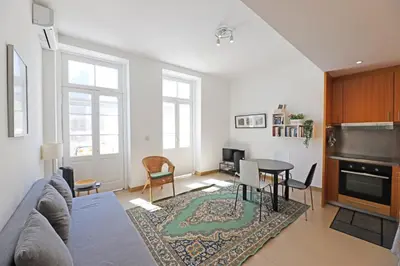 a living room with a couch and a table at FLH Porto City Apartment with Balcony in Porto