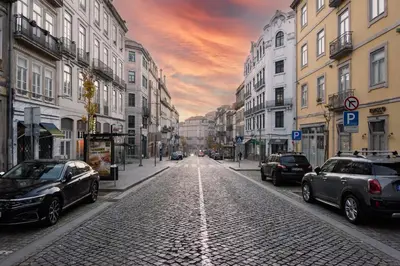 a city street with cars parked on the street at NorteSoul Mouzinho in Porto