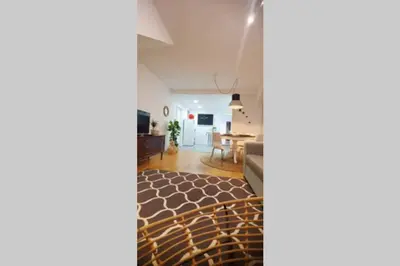 a living room with a couch and a table at T2P Mimosa House in Vila Nova de Gaia