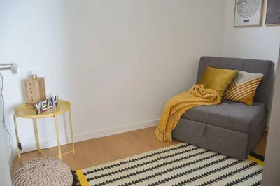 a living room with a couch and a table at T2P Mimosa House in Vila Nova de Gaia