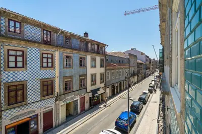 a view of a street with buildings and cars at Cedofeita Premium Apartment 2F in Porto