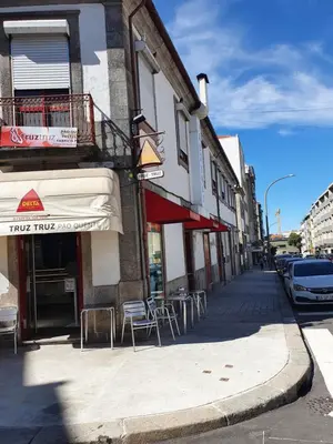 an open door to a balcony with a view of a street at Truz truz4 in Porto