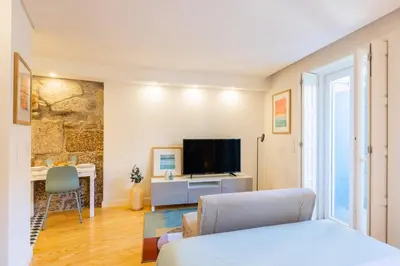 a kitchen with a sink and a counter top at Clérigos Tower - Experience in Porto in Porto
