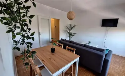 a bedroom with a bed and a large window at Apartamentos Jardim do Morro in Vila Nova de Gaia