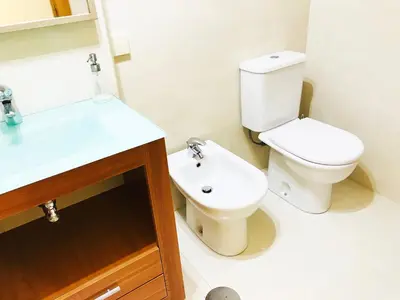 a bathroom with a toilet and a sink at Azulejos Apartment in Porto