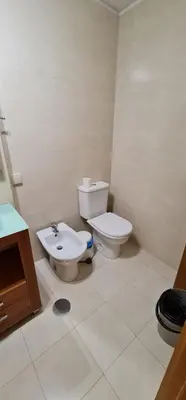 a bathroom with a toilet and a sink at Azulejos Apartment in Porto