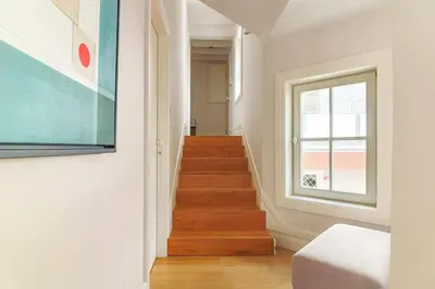 a staircase in a room with a window at MSC Flat 8 in Porto