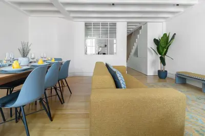 a living room with a dining room table and chairs at MSC Flat 8 in Porto