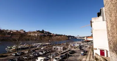 a view of a parking lot with cars parked at Casa do Recanto in Porto