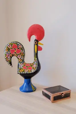 a statue of a peacock sitting next to a box at BOUTIQUE Rentals- THE RIBEIRA***** Apt great views in Porto