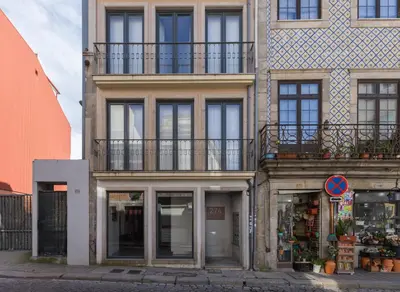 a building with windows and balconies on a street at Terrace Bliss with AC Downtown Porto in Porto