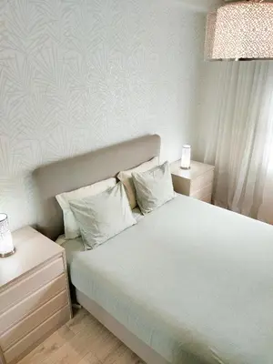 a bedroom with a large white bed with two pillows at Porto Santa Catarina - Apartment with Terrace in Porto