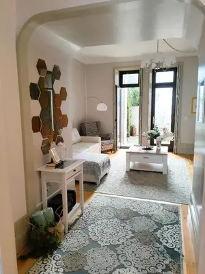a living room with a couch and a table at Porto Historic - Apartment with Private Patio in Porto