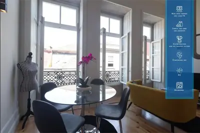 a dining room with a table and chairs at Fashion Luxury House in Porto