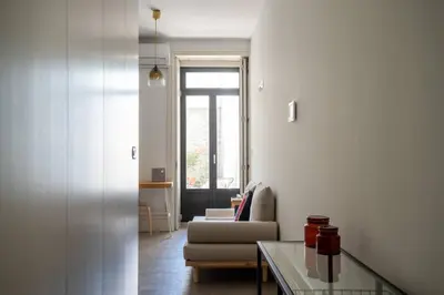a living room with a couch and a table at Amy Porto in Porto